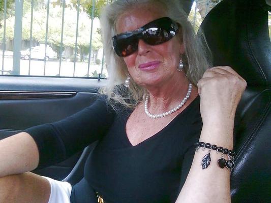 Non-nude Stunning granny goddess in her car