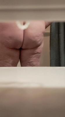 My mom in law taking a shower showing her fat pussy big tits