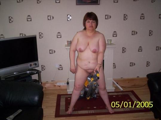 housewife doing the household chores naked