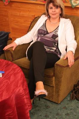 cougar`s feet in pantyhose and mules