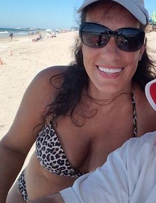 Big Titted MILF in Bikinis at the Beach .