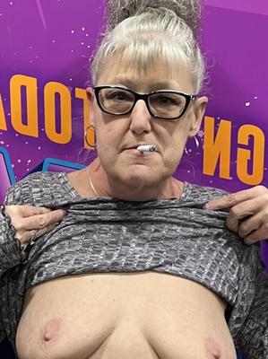 smoking granny shows off her boobs