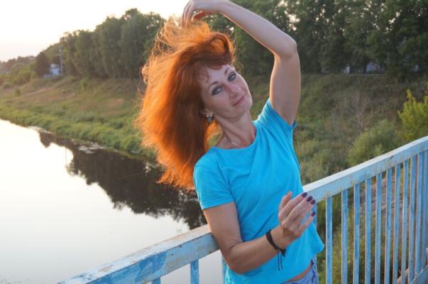 Flamehair in evening on the bridge