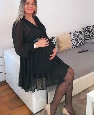 Pregnant in black stockings