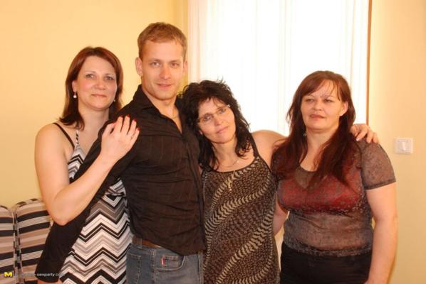 Three MILFs with a young guy